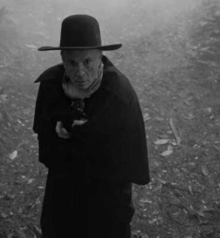 A screenshot of Bruce Dickinson in the 'Rain On The Graves' video clip